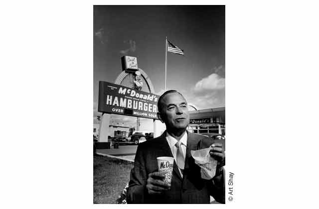 \"Make sure the flag is coming outta my head,\" McDonald\'s founder Ray Kroc suggested as I shot him for \<em\>Time\<\/em\>.\"I\'m as American as you can be.\" He was eating his first Big Mac at his first midwestern franchise. For some reason this picture has become Kroc\'s unofficial portrait. A true picture of successful American enterprise.\r\n