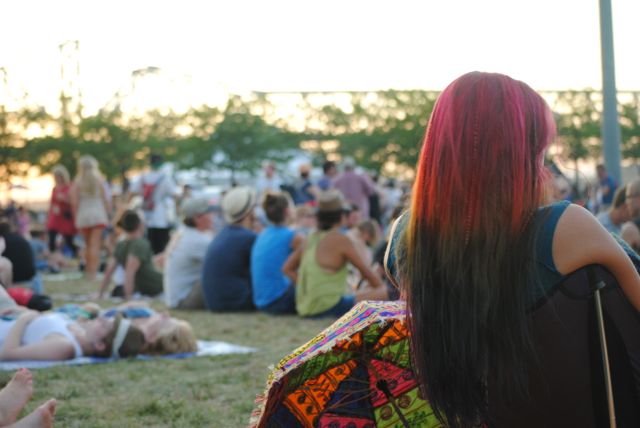 This woman\'s hair covers the rainbow from ROY to G and BIV, just one part of the soothing scene of Forecastle Fest 2012 in Louisville. Photo by Samantha Abernethy.