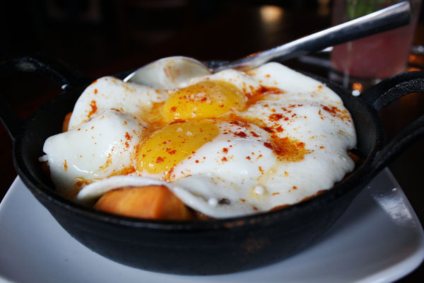 Roasted sweet potatoes with camelized onions and fried eggs