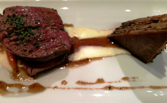 Entree: The grilled beef filet and braised short rib with exotic mushroom-potato lasagna and truffle reduction.