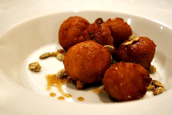 seet potato beignet with candied pumpkin seeds and maple and sherry gastrique