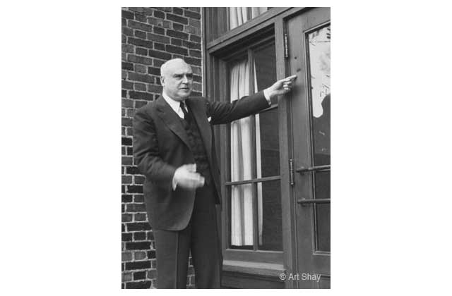 In 1954 the then owner of Kohler, Herbert V. Kohler, points out for me and the readers of \<em\>Time\<\/em\> magazine, a couple of bullet holes from a long ago strike in the 1930s. He never had the holes repaired in the bricks or doorways \"because I wanted to remind the people of Wisconsin how serious both sides were.\" In the end, arbitration prevailed.\r\n