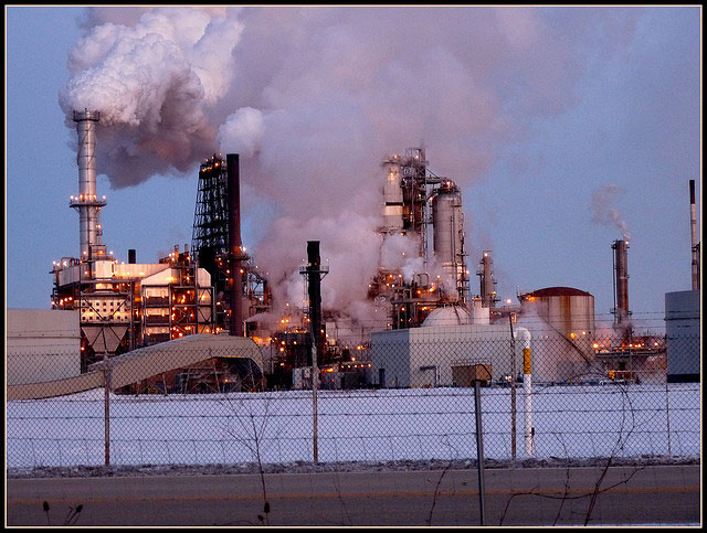 \<i\>The ExxonMobil Joliet Refinery is billed as one of the youngest and most energy efficient facilities of its kind in the country. The 240,000 barrel/day refinery reports emissions of 2,510,396 metric tons of CO2e and unfortunately also slicked roads in October when it \<a href=\"http://chicagoist.com/2012/10/20/exxonmobil_mess_refinery_spews_oil.php\"\>emitted oily substances into the air\<\/a\> that \<a href=\"http://heraldnews.suntimes.com/business/15842943-420/petroleum-by-product-spill-at-exxon-mobil-refinery-closes-road.html\"\>traveled as far as 5 miles away\<\/a\>.\<\/i\>