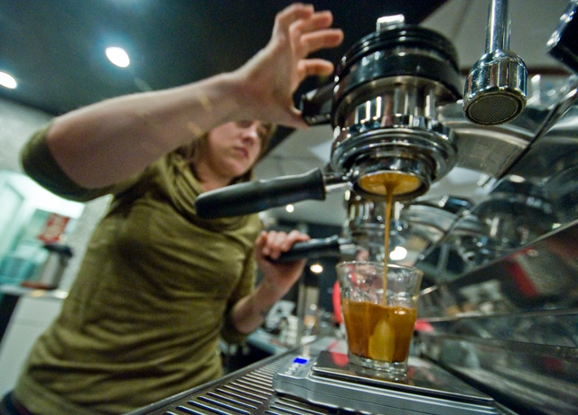 Sara Travis, founder of Wormhole Coffee, prepares espresso.