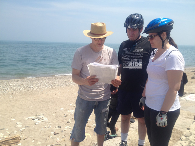 Greg Lane doing what he does every Sunday, talking about the wonders of Chicago\'s Morgan Shoal (with Jeannie and Marty McGrory on 49th Street Beach).