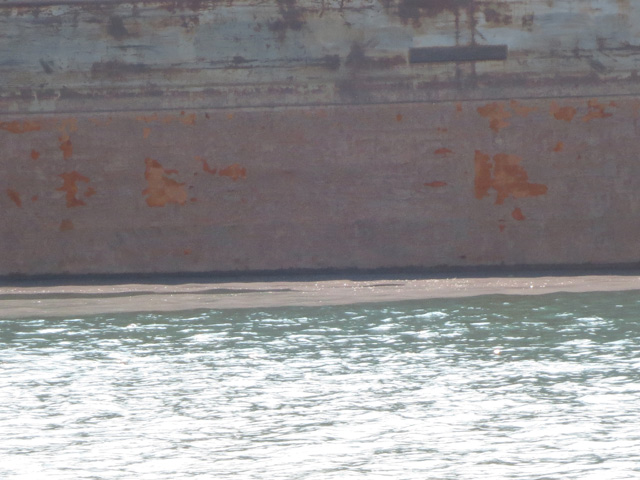 Dust from the piles and barges moored along the Calumet mucks the river in places.