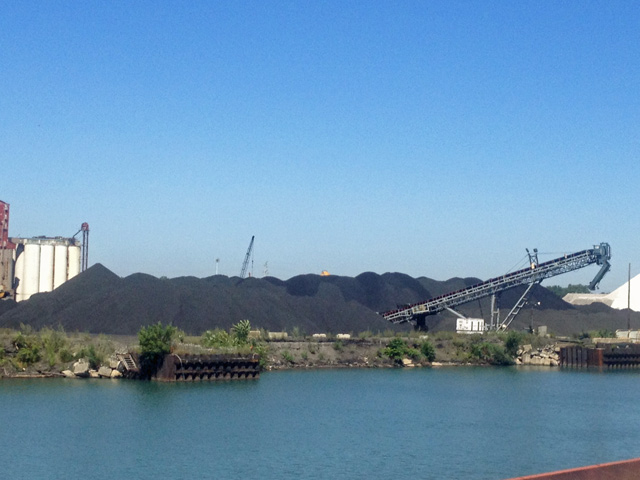 Petcoke piles on the banks of the Calumet River.