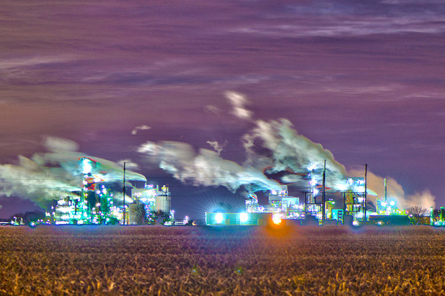 \<i\>Technically in Channahon, the ExxonMobil Joliet Refinery is billed as one of the youngest and most energy efficient facilities of its kind in the country. The 240,000 barrel/day refinery emitted more than 2.3 million tons of CO2 equivalent in 2012, one of the highest totals in Illinois. The facility notoriously slicked roads last October when it \<a href=\"http://chicagoist.com/2012/10/20/exxonmobil_mess_refinery_spews_oil.php\"\>emitted oily substances into the air\<\/a\> that \<a href=\"http://heraldnews.suntimes.com/business/15842943-420/petroleum-by-product-spill-at-exxon-mobil-refinery-closes-road.html\"\>traveled as far as 5 miles away\<\/a\>.\<\/i\>